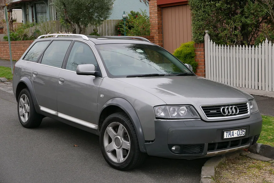 Silver Audi allroad quattro (C5) 2.5 TDI parked on a suburban street, three-quarter front view