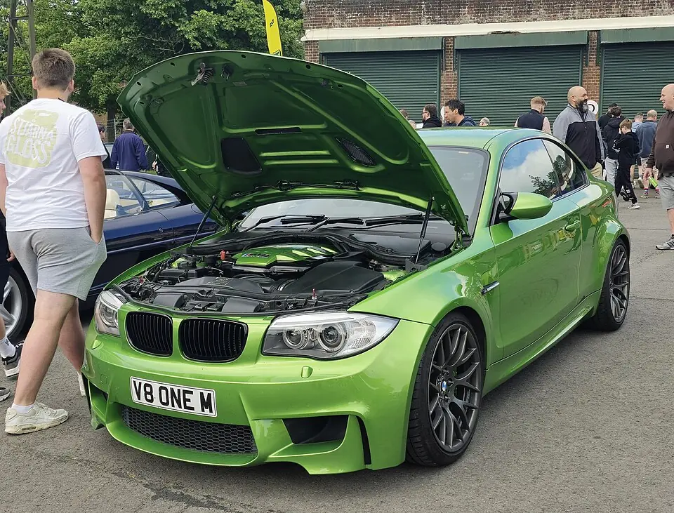 Orange BMW 1M Coupé, three-quarter front view