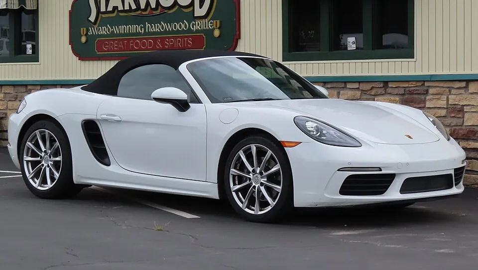 White Porsche 718 Boxster (982), roof up, front three-quarter view