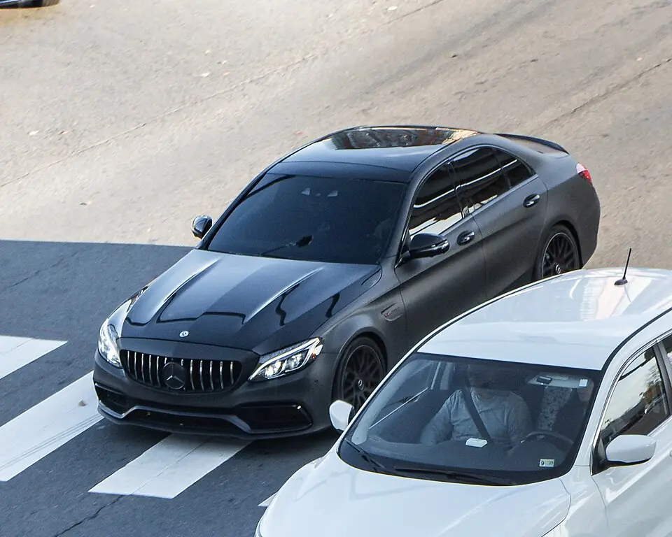 White Mercedes-AMG C 63 S sedan (W205), three-quarter front view