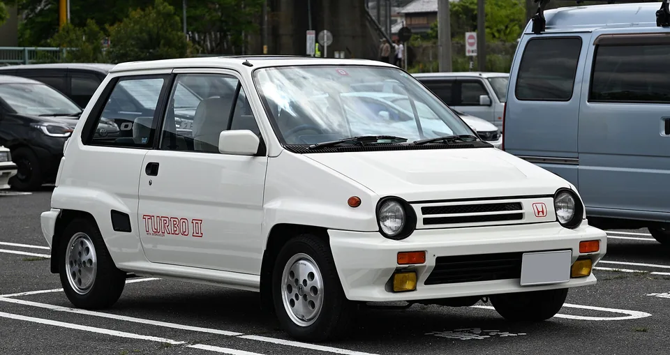 White Honda City Turbo II with blistered arches, three-quarter front view