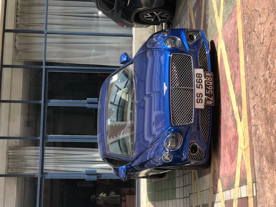 Blue Bentley Continental GT, front view