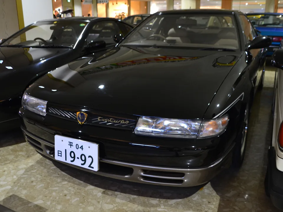 Black Mazda Eunos Cosmo 20B Type-E, three-quarter front view