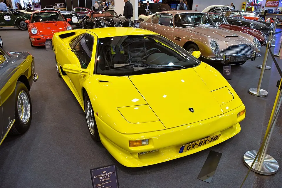 Red Lamborghini Diablo (1991) with pop-up headlights, three-quarter front view