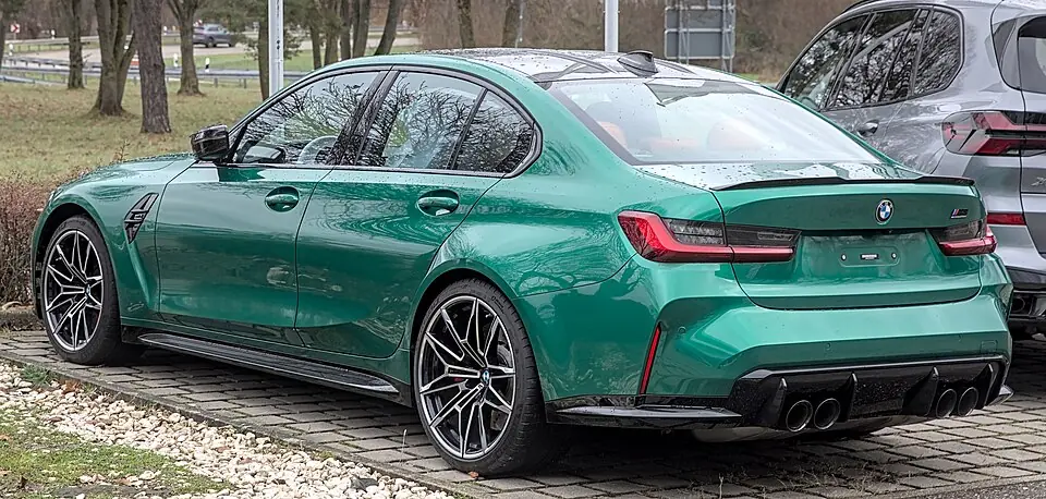 Green BMW M3 Competition G80, three-quarter front view