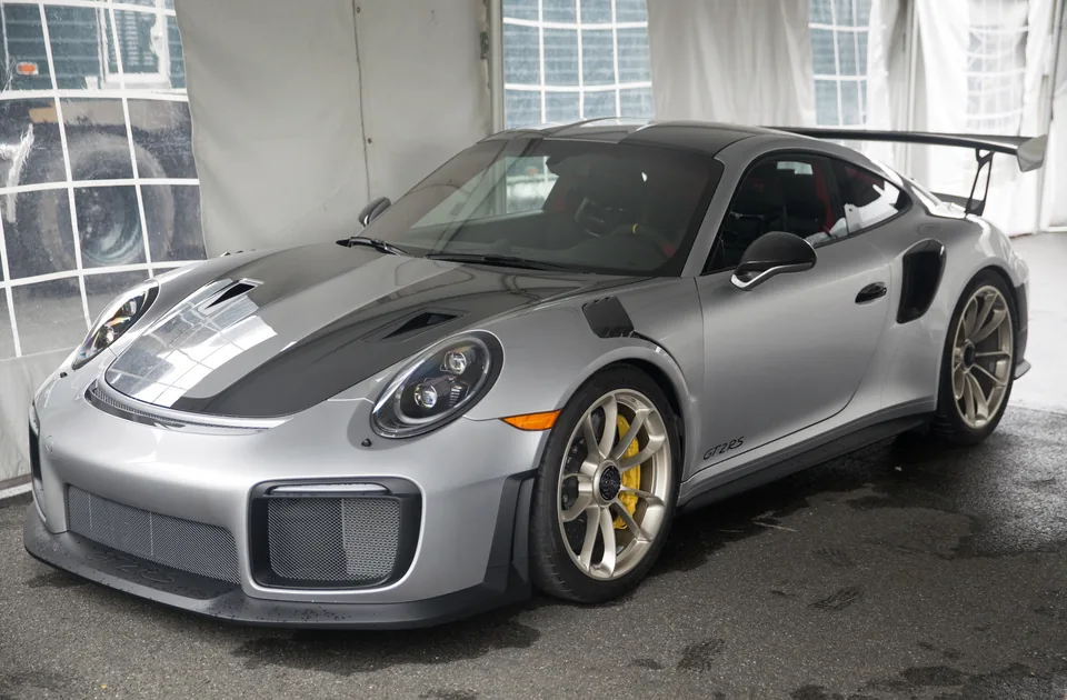 Silver Porsche 911 GT2 RS (991.2) with fixed rear wing, three-quarter front view