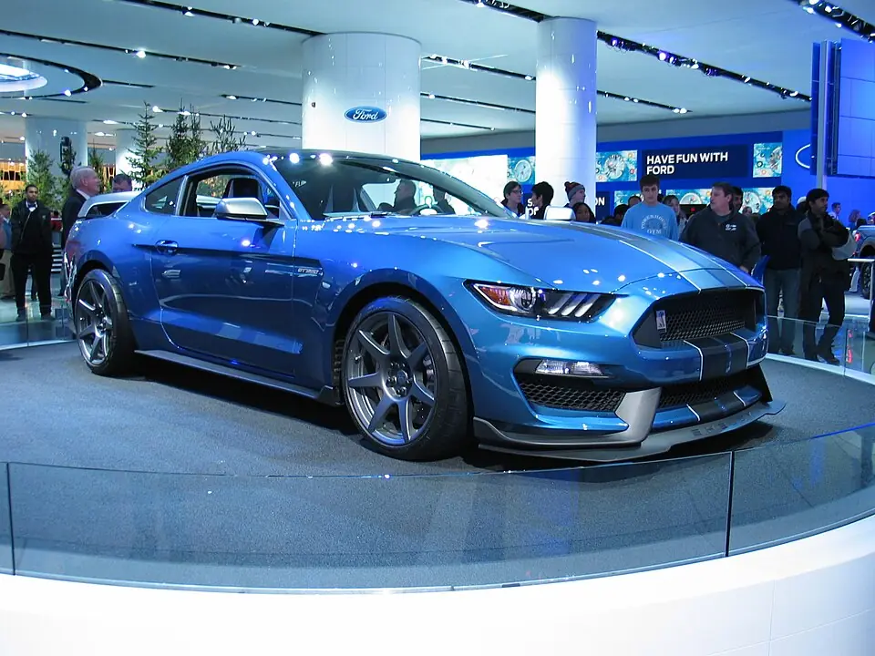 White Shelby GT350R with blue stripes, front view