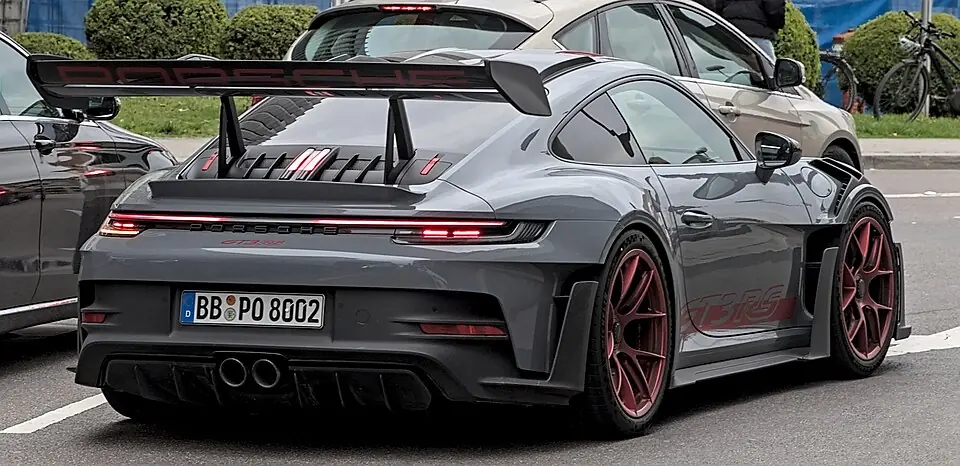 Grey Porsche 911 GT3 RS (992) with large rear wing, rear view