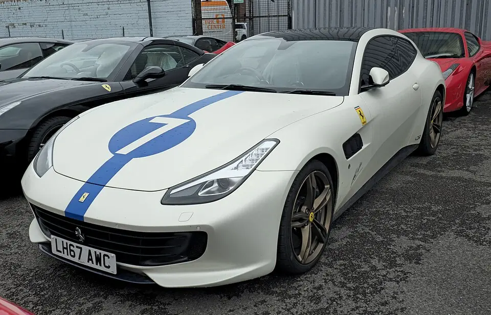 White Ferrari GTC4Lusso with blue stripe, three-quarter front view