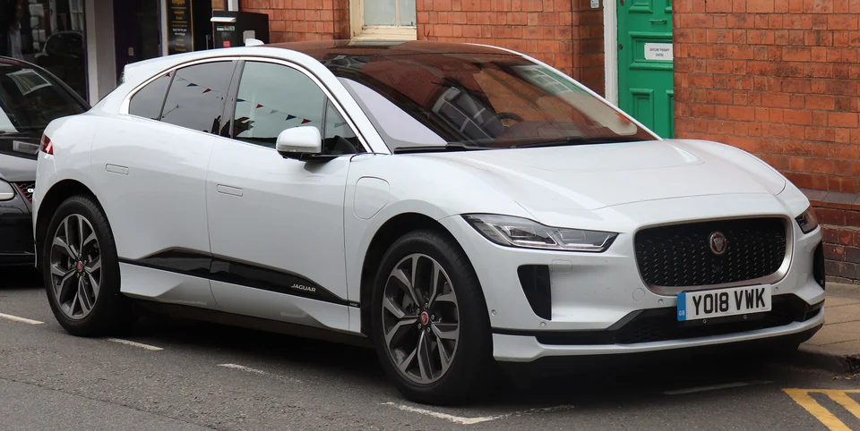 White Jaguar I-Pace EV400 parked on a British street, three-quarter front view