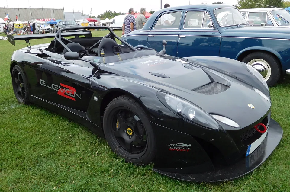 Black Lotus 2-Eleven with roll hoops and rear wing, three-quarter front view