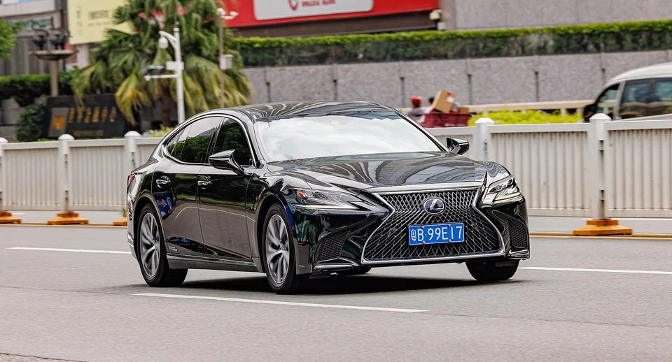 Black Lexus LS 500h (XF50) on a Shenzhen street, three-quarter front view