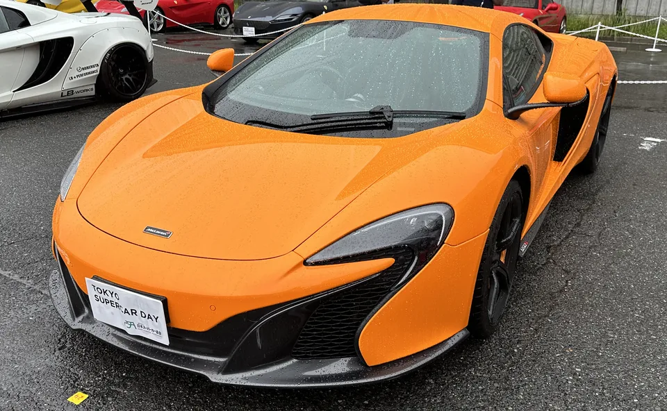 Orange McLaren 650S, three-quarter front view
