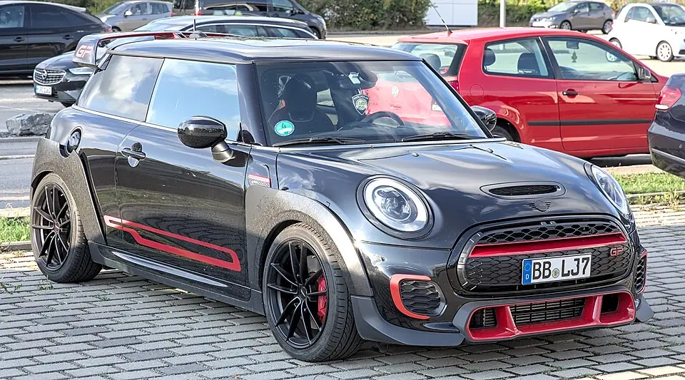 Black Mini John Cooper Works GP (F56) with red accents, front three-quarter view