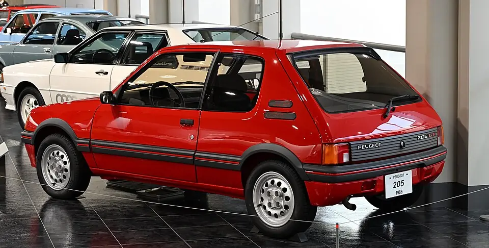 Red Peugeot 205 GTI, rear three-quarter view
