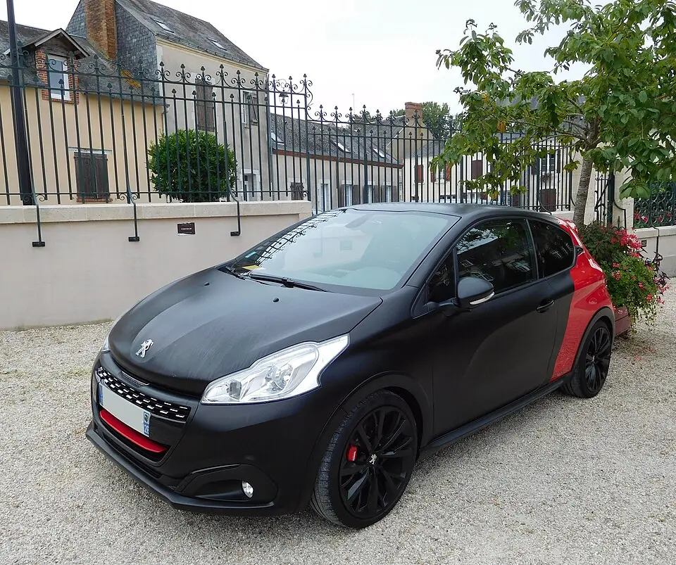 Matte black and red Peugeot 208 GTi 30th Anniversary by Peugeot Sport, front three-quarter view