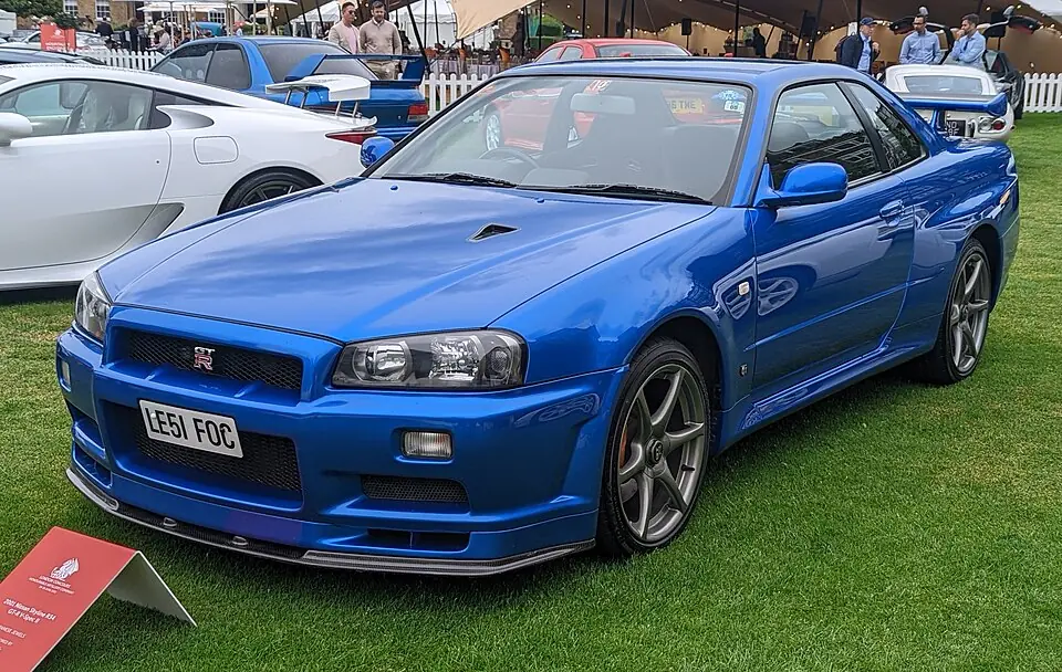 Bayside Blue Nissan Skyline GT-R V-Spec II R34, three-quarter front view
