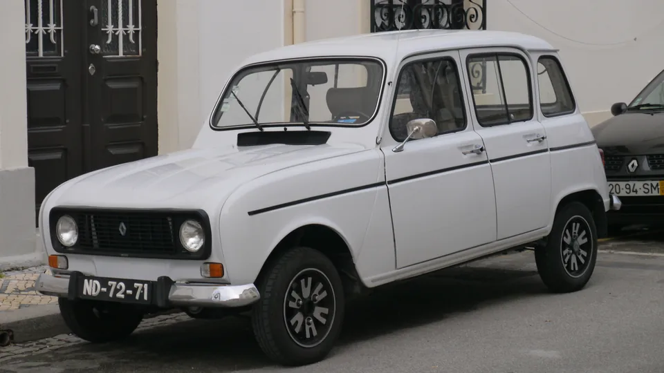 White Renault 4 GTL parked on a cobbled street in Braga, Portugal, three-quarter front view