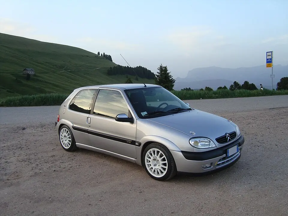 Silver Citroën Saxo VTS in a mountain pass, three-quarter front view