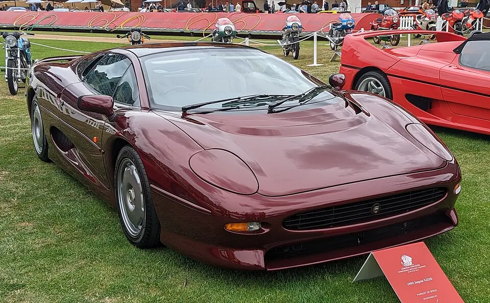 Maroon Jaguar XJ220, three-quarter front view